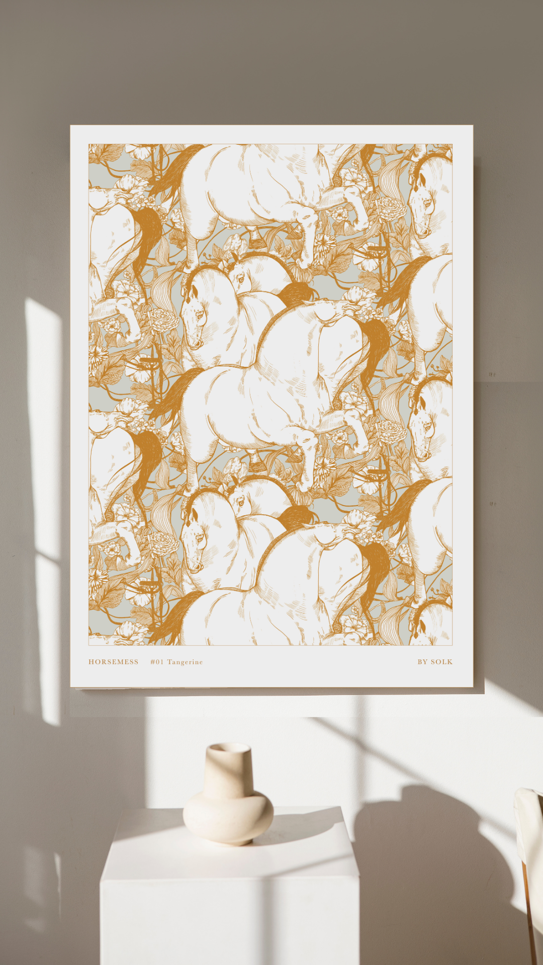 Framed horse art print with gold and white design on a neutral wall.