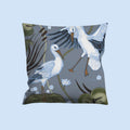 Decorative pillow with artistic stork design on a gray background